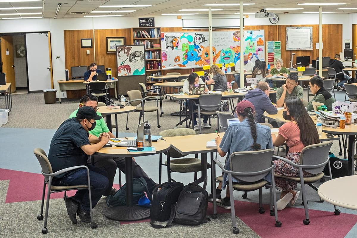 student study in various groups in the student success center